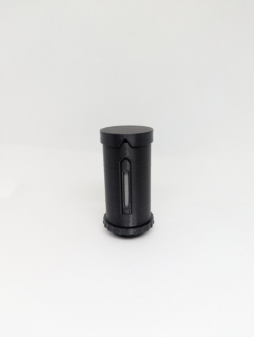 DoseMate Spin Core Black travel powder dispenser with matte black finish